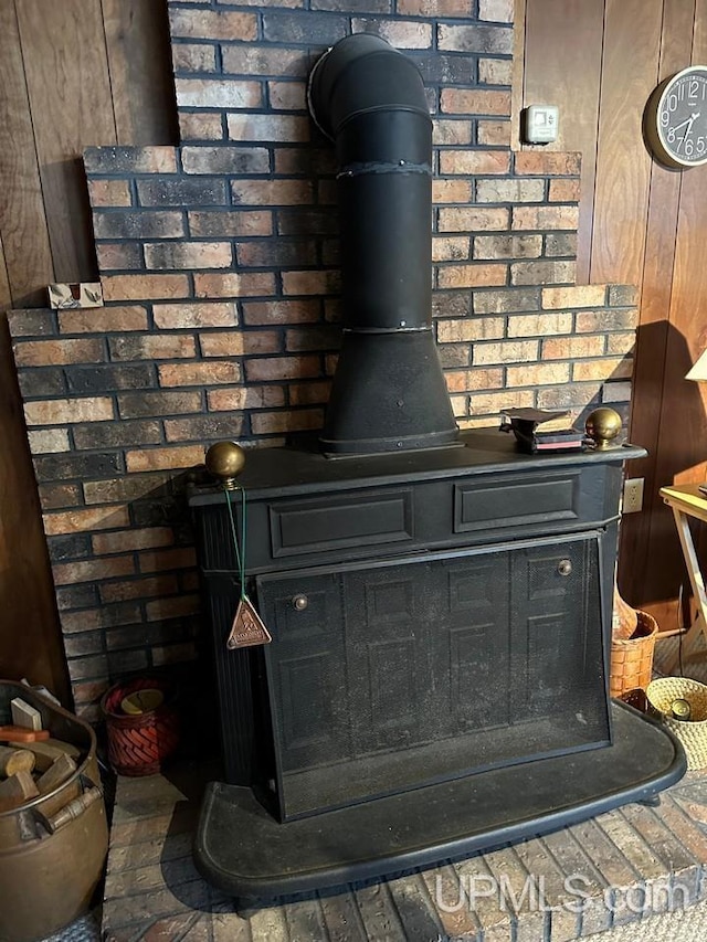 details with a wood stove and wooden walls