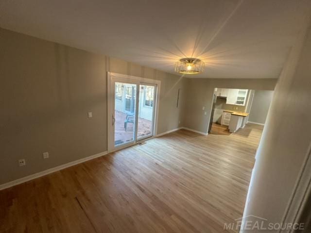 unfurnished living room featuring light hardwood / wood-style floors