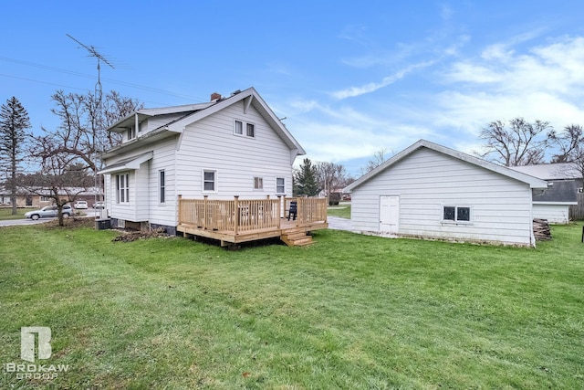 back of house featuring a deck and a yard