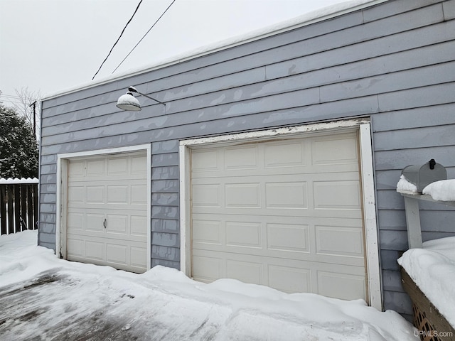 view of snow covered garage