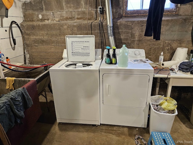 laundry area with washing machine and clothes dryer