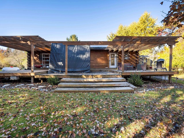 exterior space featuring a pergola and a deck