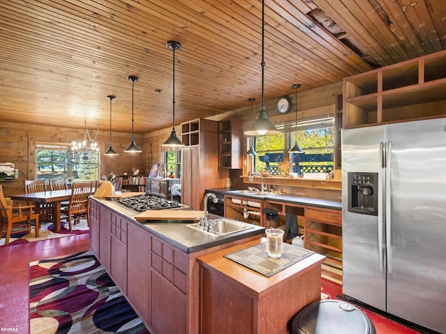 kitchen featuring a center island with sink, plenty of natural light, appliances with stainless steel finishes, and stainless steel counters