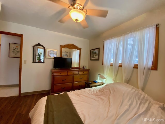 bedroom featuring hardwood / wood-style flooring and ceiling fan