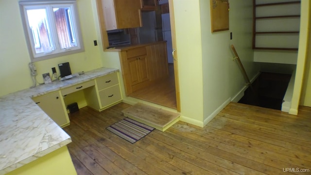 bathroom with hardwood / wood-style floors