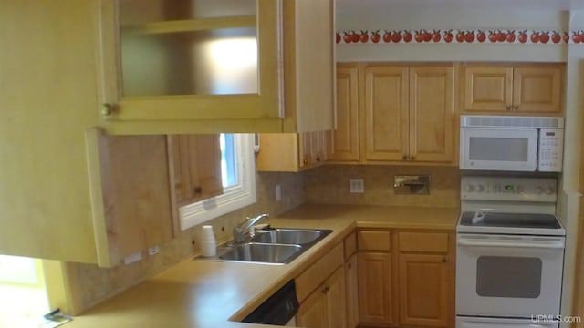 kitchen with decorative backsplash, light brown cabinets, white appliances, and sink