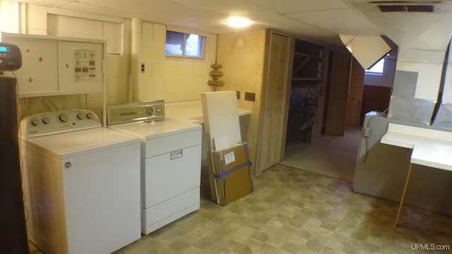 laundry area featuring washing machine and clothes dryer