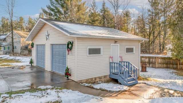 view of snow covered garage