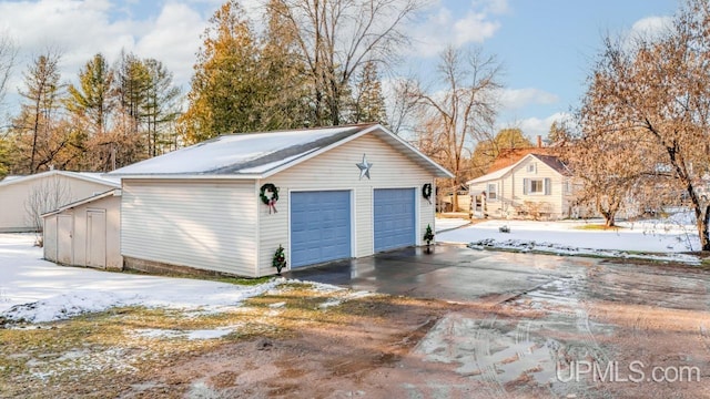 view of snow covered garage