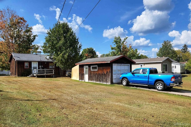 exterior space with a garage and an outdoor structure