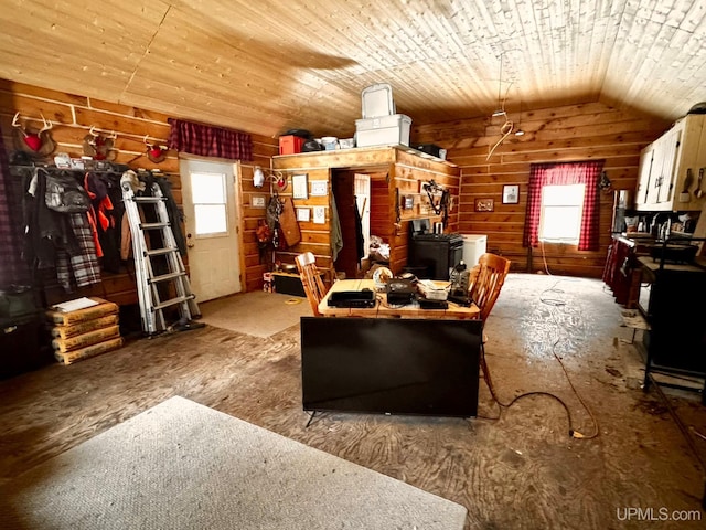 unfurnished living room featuring lofted ceiling