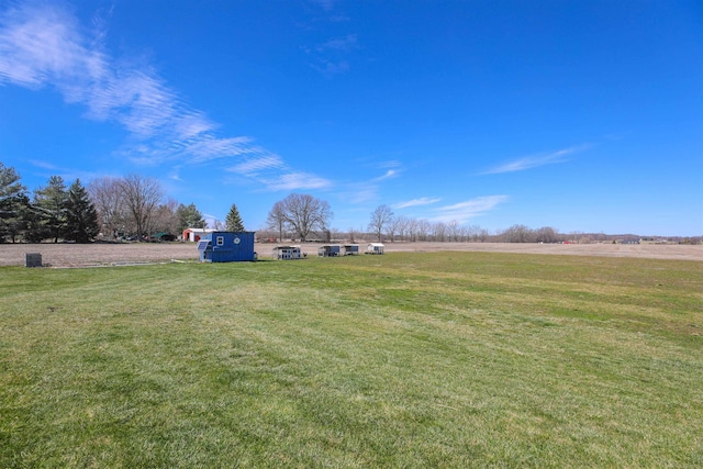 view of yard with a rural view