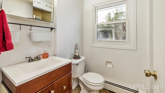 bathroom featuring vanity, a baseboard radiator, and toilet