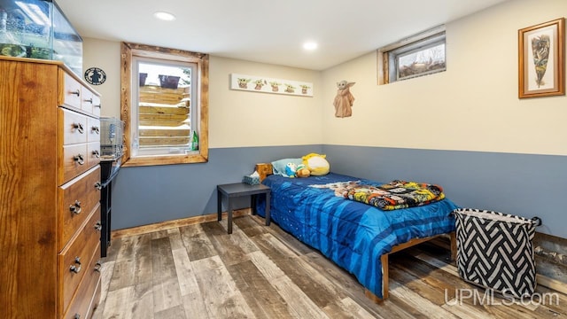 bedroom with hardwood / wood-style flooring