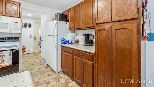 kitchen featuring white appliances and a baseboard radiator