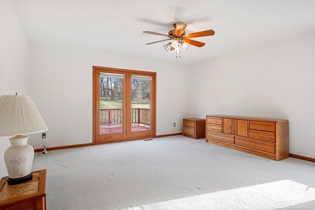 interior space with ceiling fan, access to exterior, and light carpet