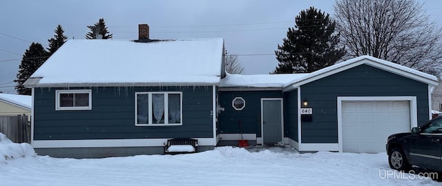 single story home with a garage