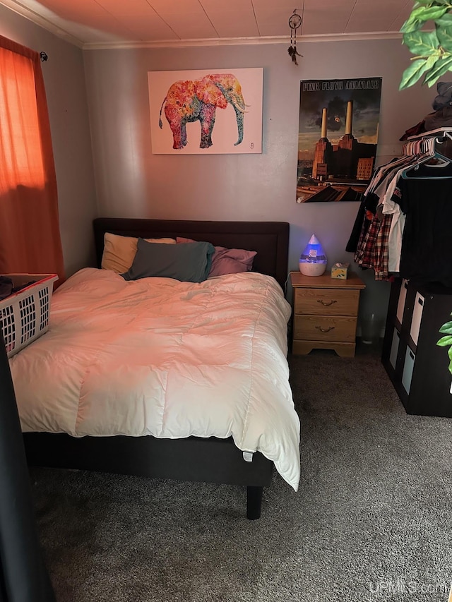 carpeted bedroom featuring ornamental molding