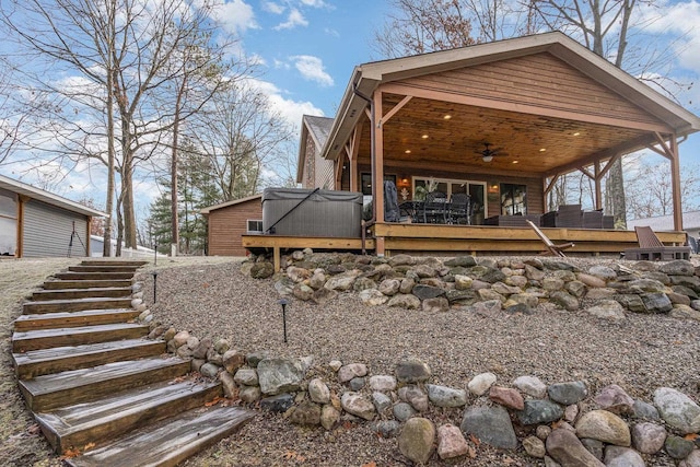 back of house with ceiling fan