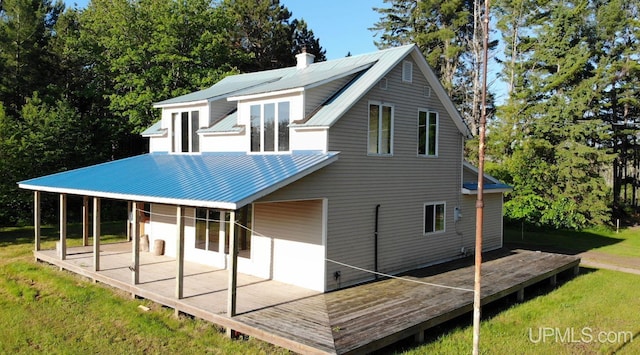 rear view of property featuring a patio