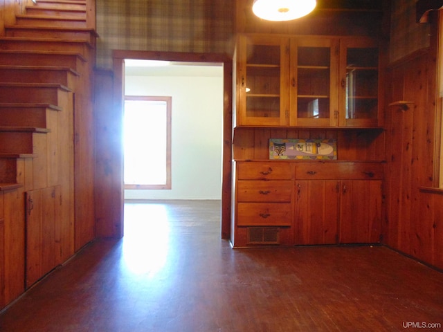 unfurnished dining area with dark hardwood / wood-style flooring