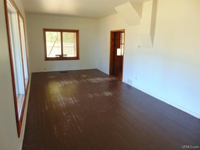 spare room featuring dark hardwood / wood-style floors