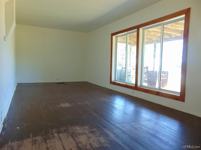 empty room featuring dark hardwood / wood-style floors