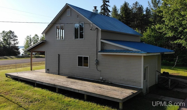 back of property featuring a deck