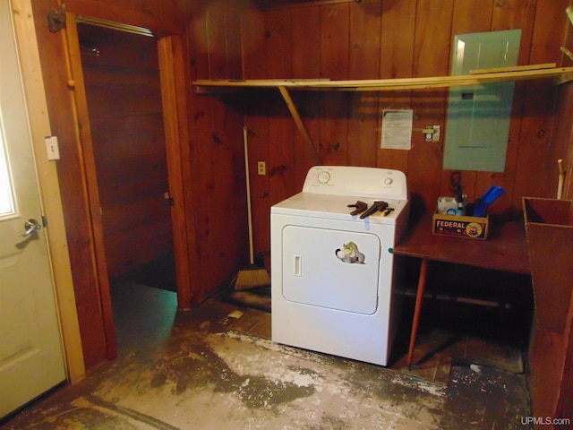 laundry room featuring washer / clothes dryer and wood walls