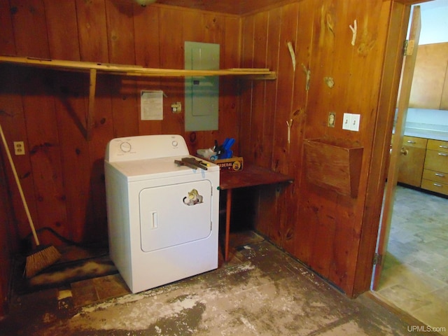 laundry room with washer / clothes dryer, wooden walls, and electric panel