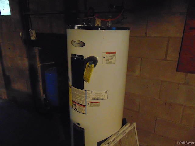 utility room with water heater