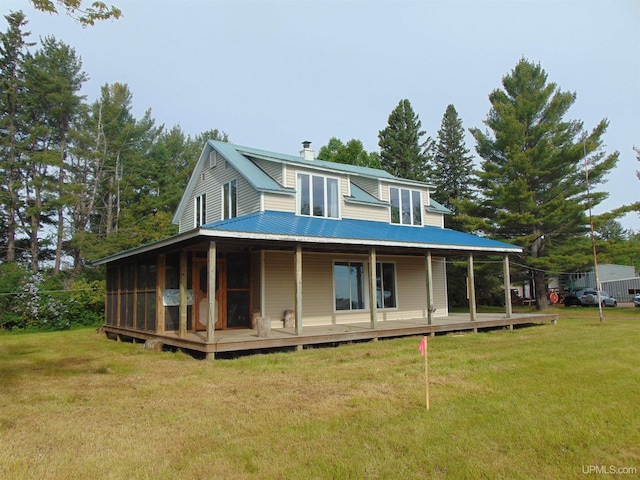 rear view of house with a lawn