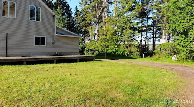 view of yard featuring a wooden deck