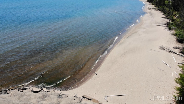 aerial view featuring a water view and a view of the beach