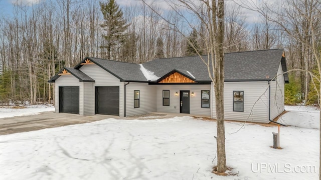 modern farmhouse style home featuring a garage