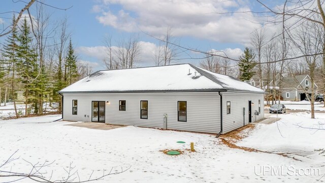 view of snow covered house