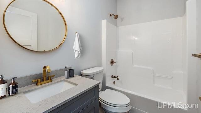 full bathroom with toilet, vanity, and shower / bathing tub combination