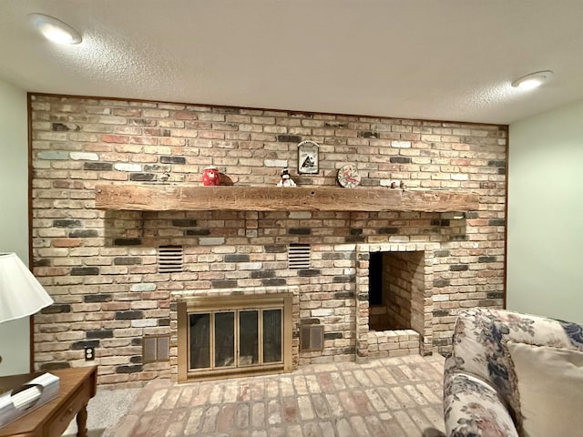 details with a textured ceiling and a fireplace