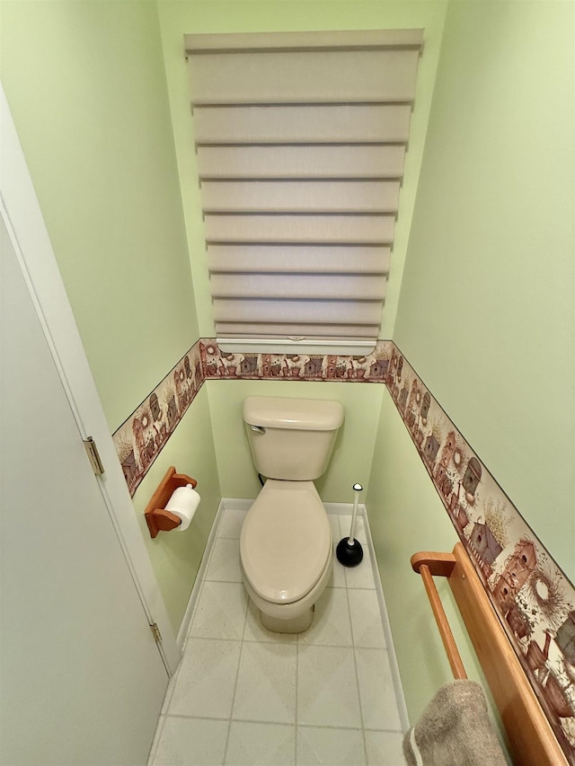 bathroom featuring tile patterned flooring and toilet