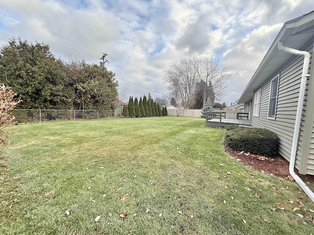 view of yard featuring a wooden deck