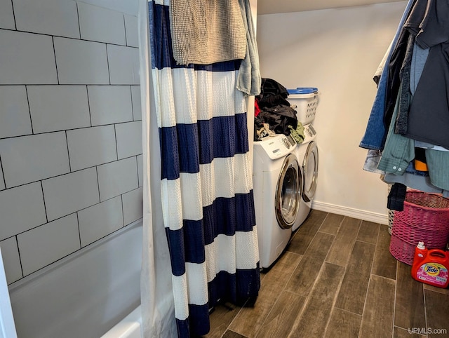 laundry room with independent washer and dryer and dark wood-type flooring