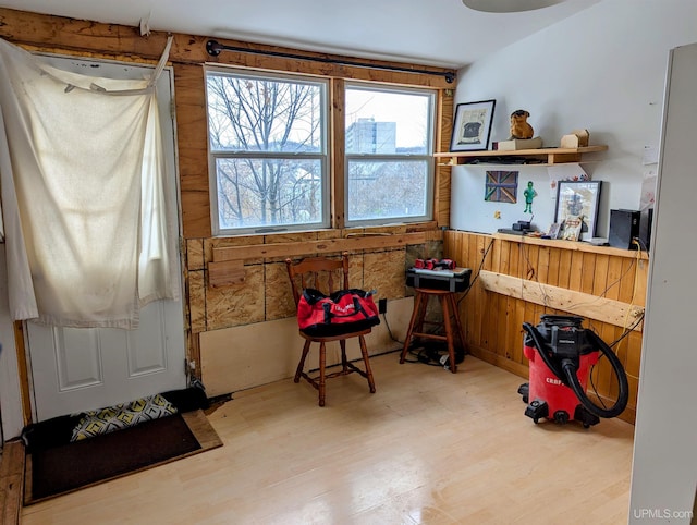 misc room with wooden walls and hardwood / wood-style floors