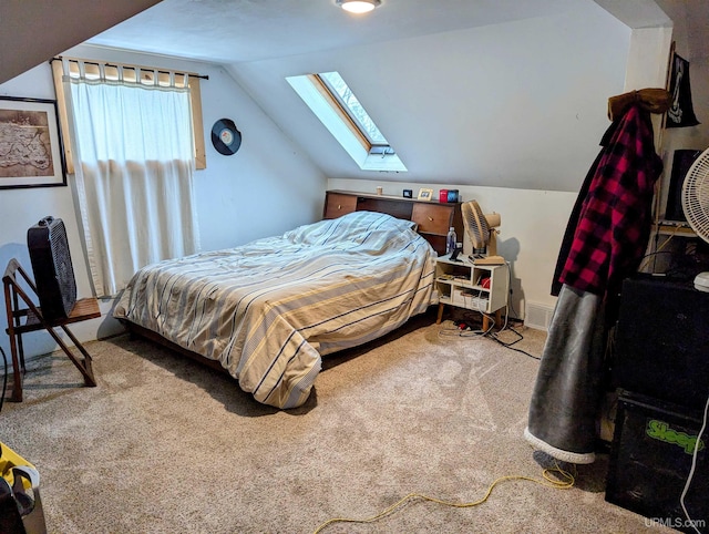 carpeted bedroom with vaulted ceiling