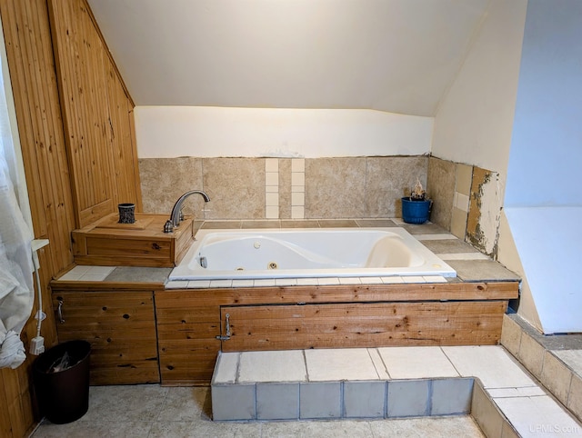 bathroom featuring tiled tub