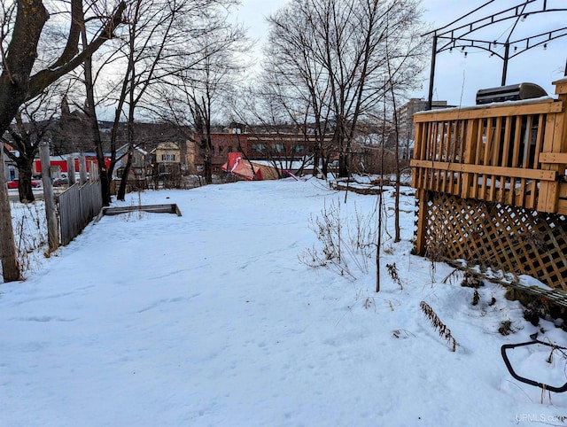 view of yard layered in snow