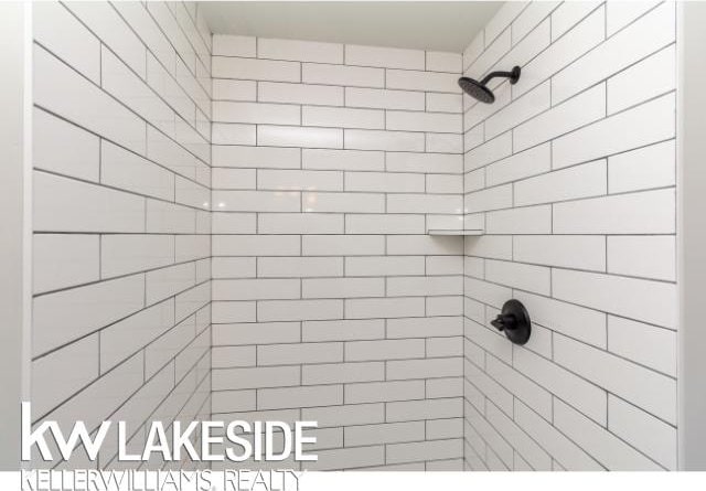 bathroom with a tile shower