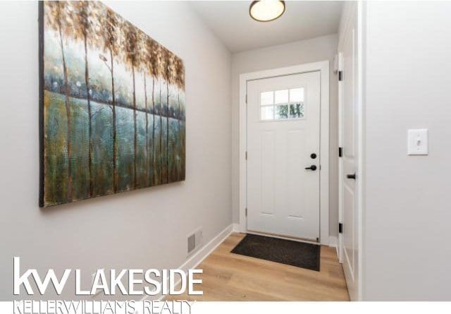 entryway with light hardwood / wood-style floors