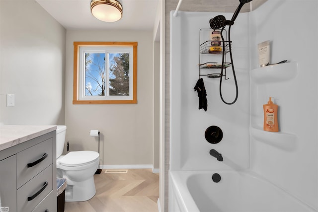 full bathroom with vanity, toilet, and  shower combination