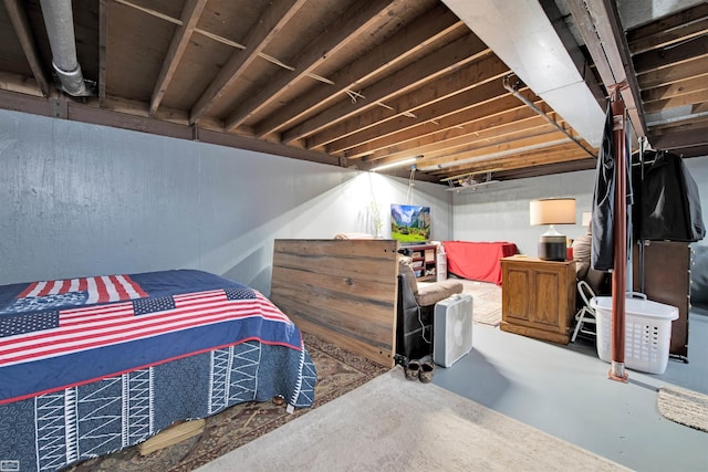 bedroom featuring concrete flooring