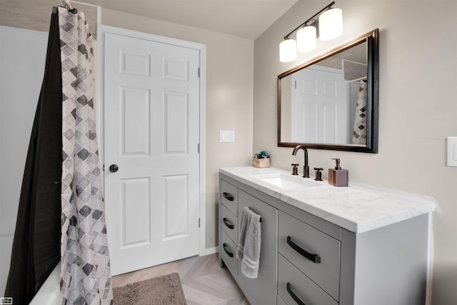 bathroom with vanity and parquet floors